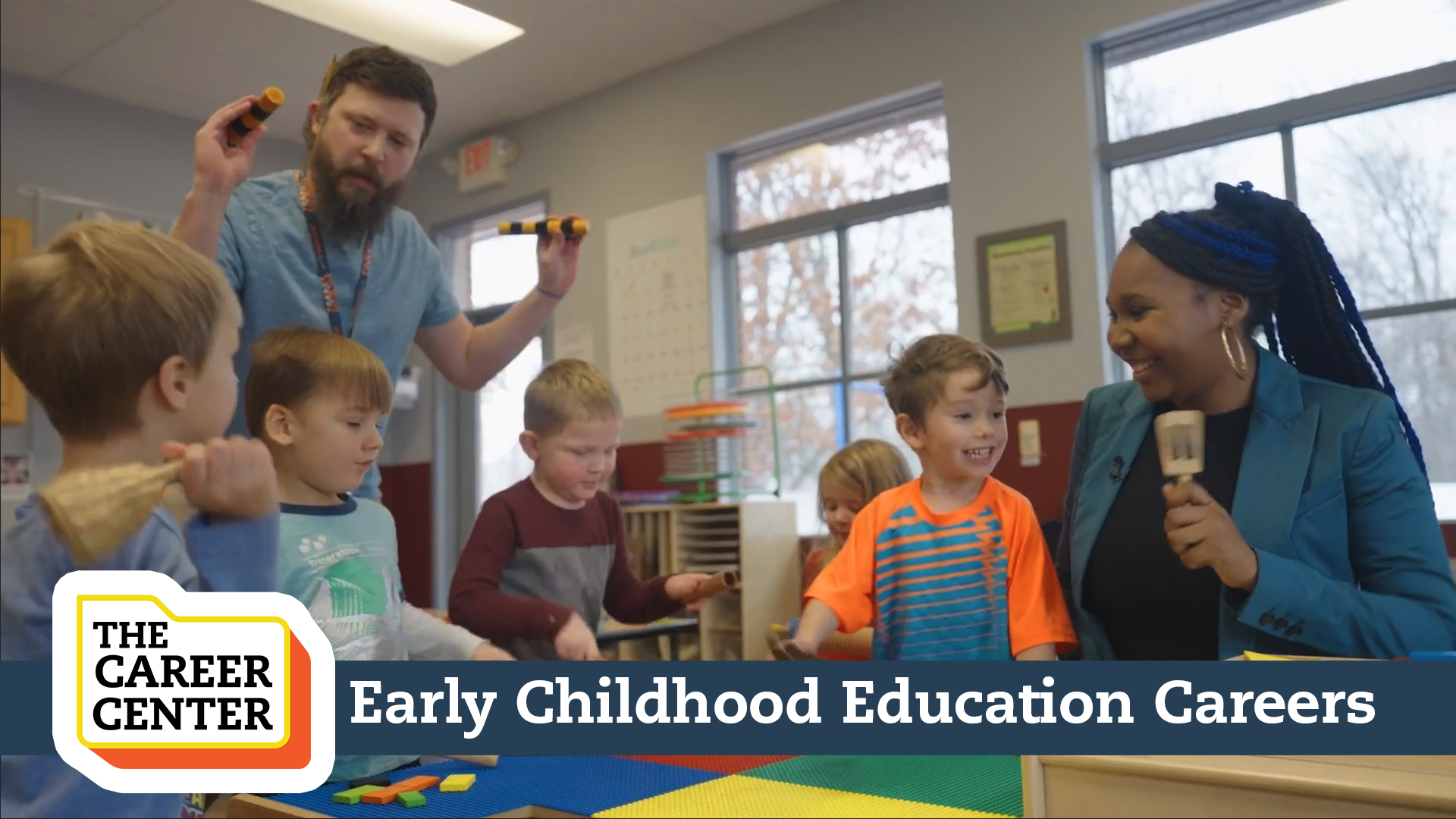 Educators and children playing in a classrooom